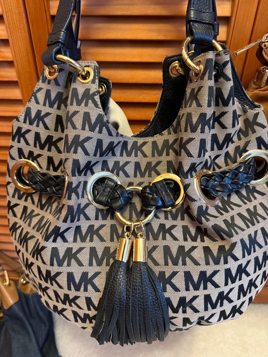 Michael Kors Handbags - Michael Kors Black and Tan MK Logo Drawstring Hobo with Tassel